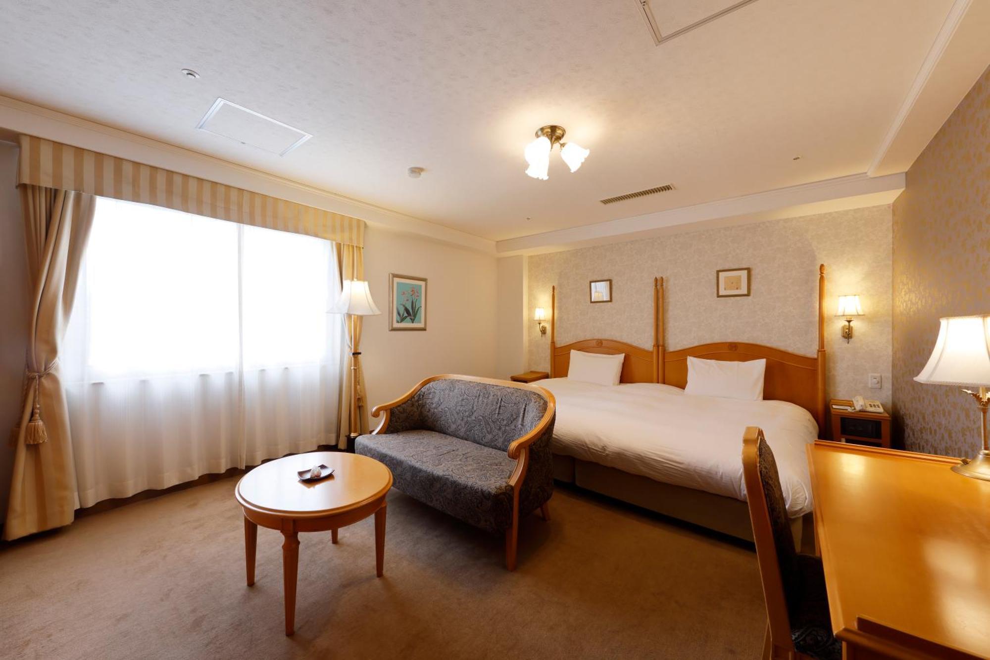 Kanazawa Hakuchoro Hotel Sanraku -Natural Hot Spring- Esterno foto A room at the hotel